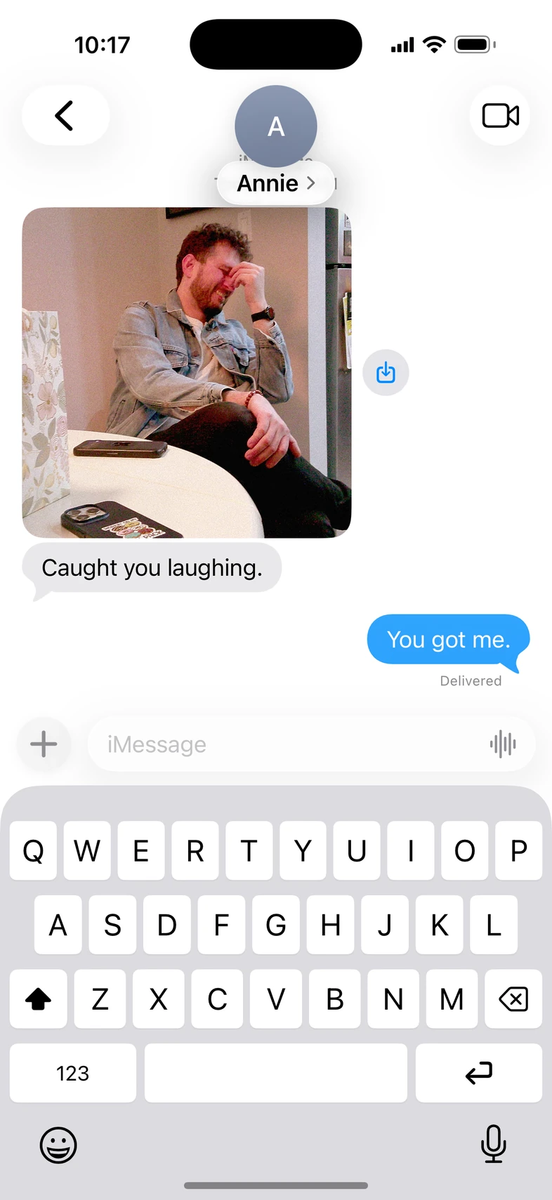 Annie sends a candid photograph with ‘Caught you laughing.’ and receives ‘You got me.’
