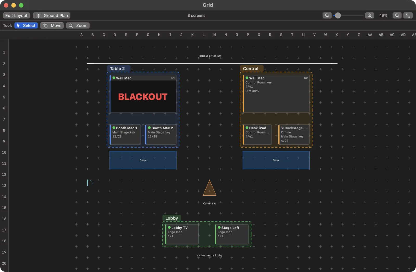 The Grid: a plan of a harbour office set with a wall, two desks, and Camera A. Screen tiles sit where they hang inside the Table 2, Control, and Lobby group outlines. Wall Mac S1 reads BLACKOUT, and the offline Backstage Mac is marked.